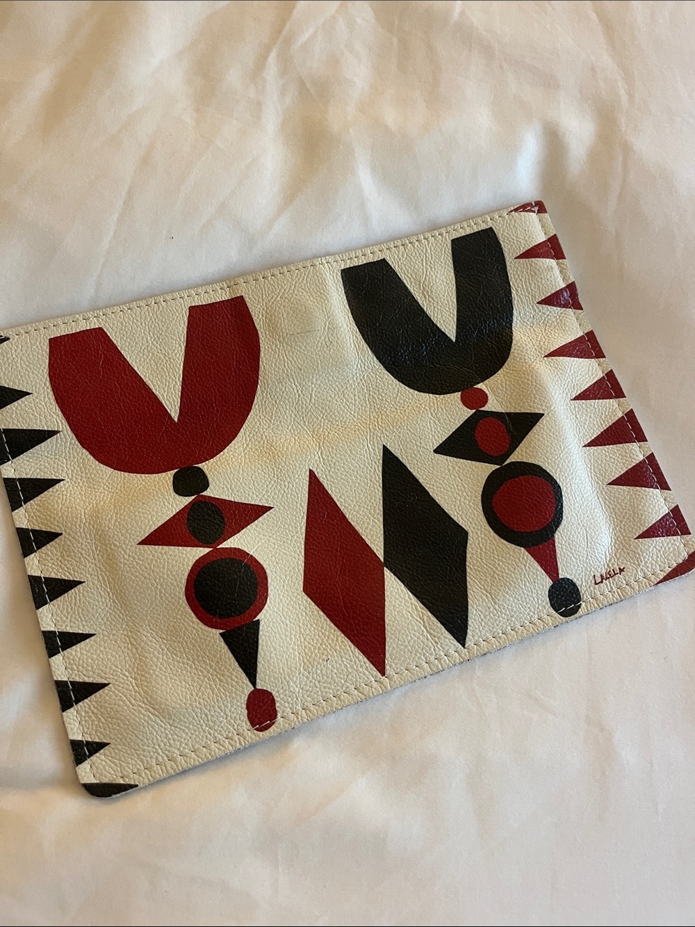 Lalela ethnic print 100% Leather clutch w/hidden magnet closure.8” x 10”